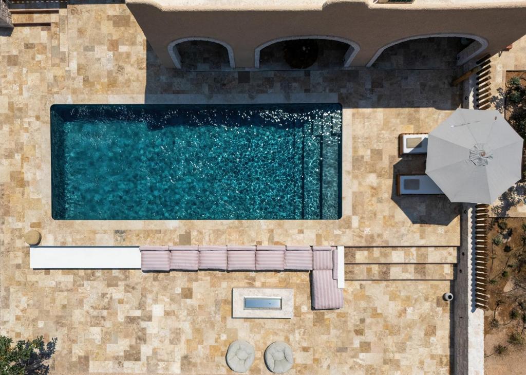 an overhead view of a swimming pool in a villa at Oinopia Country Villas in Egina
