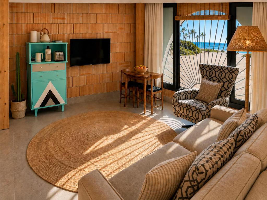 a living room with a couch and a table at Viviendas El Tiburón in Almerimar