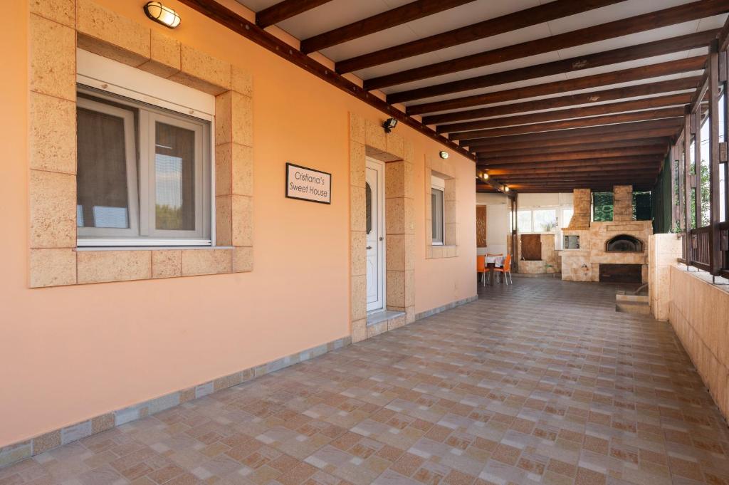 an empty hallway of a building with a window at Christiana's sweet house in Kos