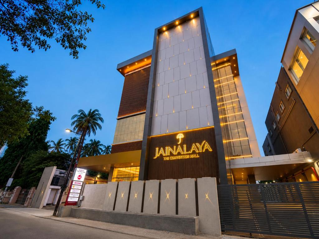 a building with a sign in front of it at Jain Tree by Spree Hotels Vellore in Vellore