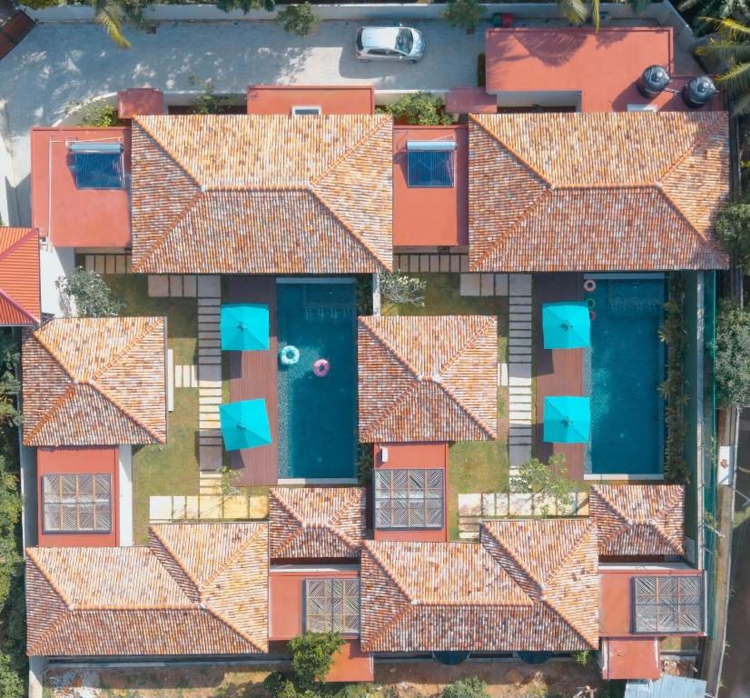 an aerial view of a house with orange roofs at Eden Collection Thalpe in Talpe