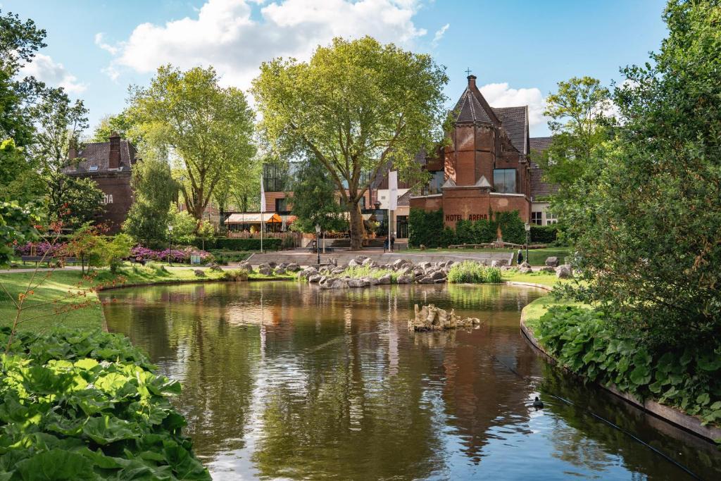 a view of a river in front of a building at Hotel Arena in Amsterdam