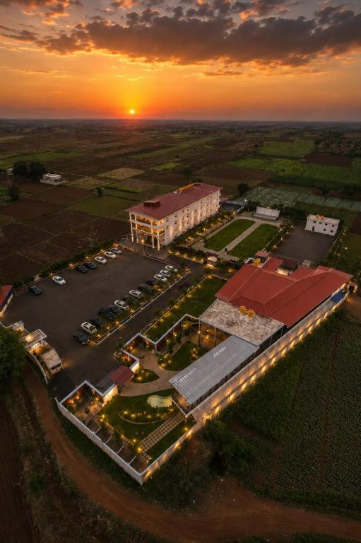an aerial view of a building with a parking lot at Prakruthi Retreat Belagavi in Belgaum