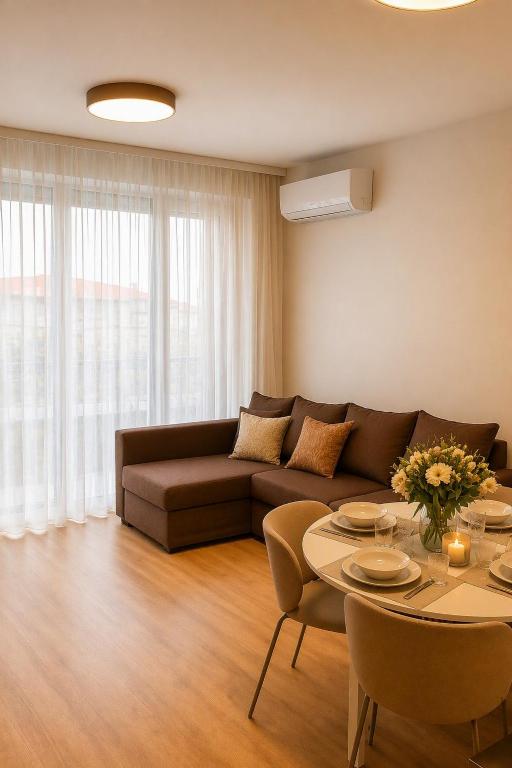 a living room with a couch and a table at Apartament 1go Maja TK in Namysłów