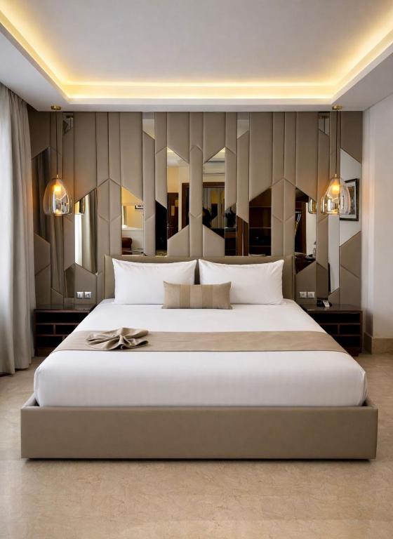 a large bedroom with a large white bed in it at One Hotel Casablanca in Casablanca