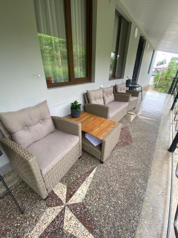 a living room with two couches and a table at Zurkas’ guesthouse in Batumi