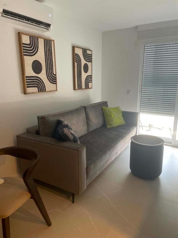a living room with a couch and a table at Costa Royale APARTAMENT in Torrevieja