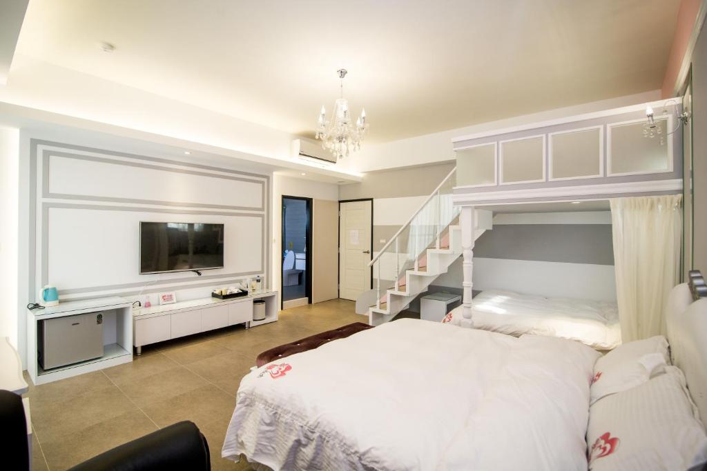 Postel nebo postele na pokoji v ubytování Ai Lian Shan Shui Homestay
