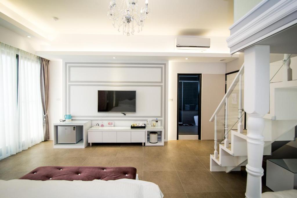 TV a/nebo společenská místnost v ubytování Ai Lian Shan Shui Homestay