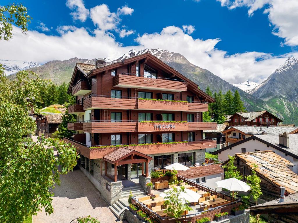 an aerial view of a hotel in the mountains at The Capra Saas-Fee in Saas-Fee