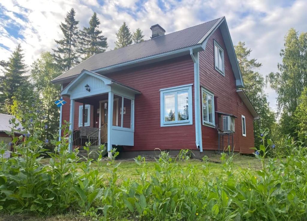 a red house with a gambrel at Villa Frida in Kilen