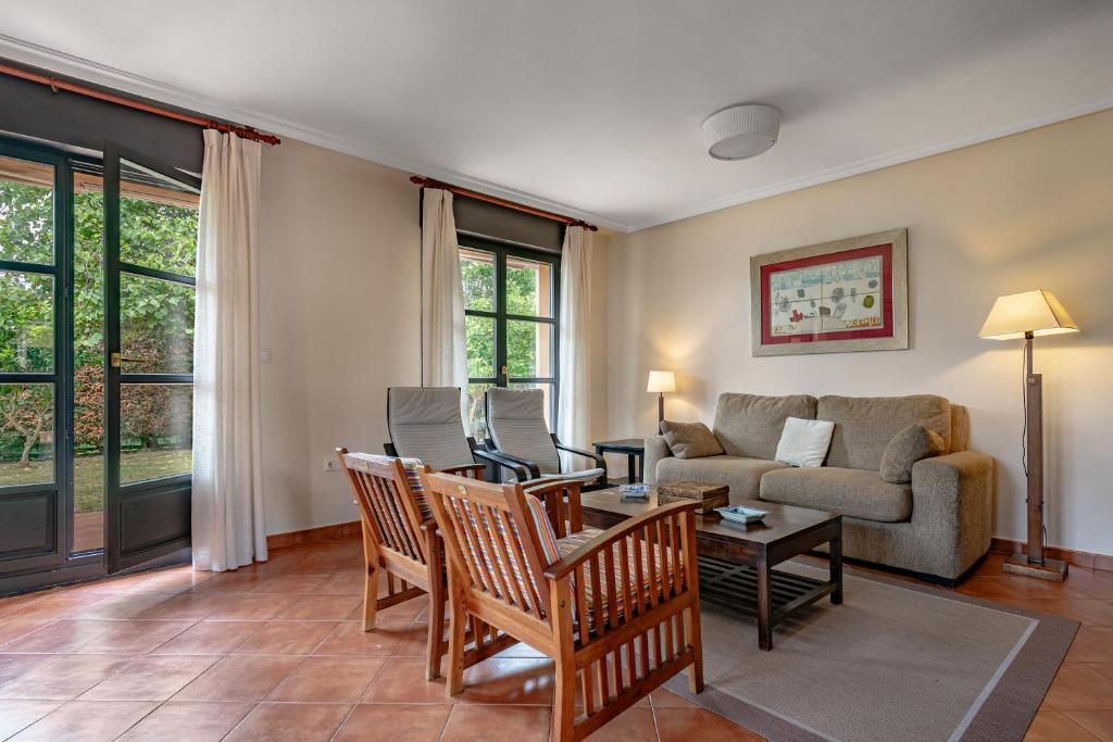 a living room with a couch and a table at Chalet Picu Fontanielles en Colunga in Colunga