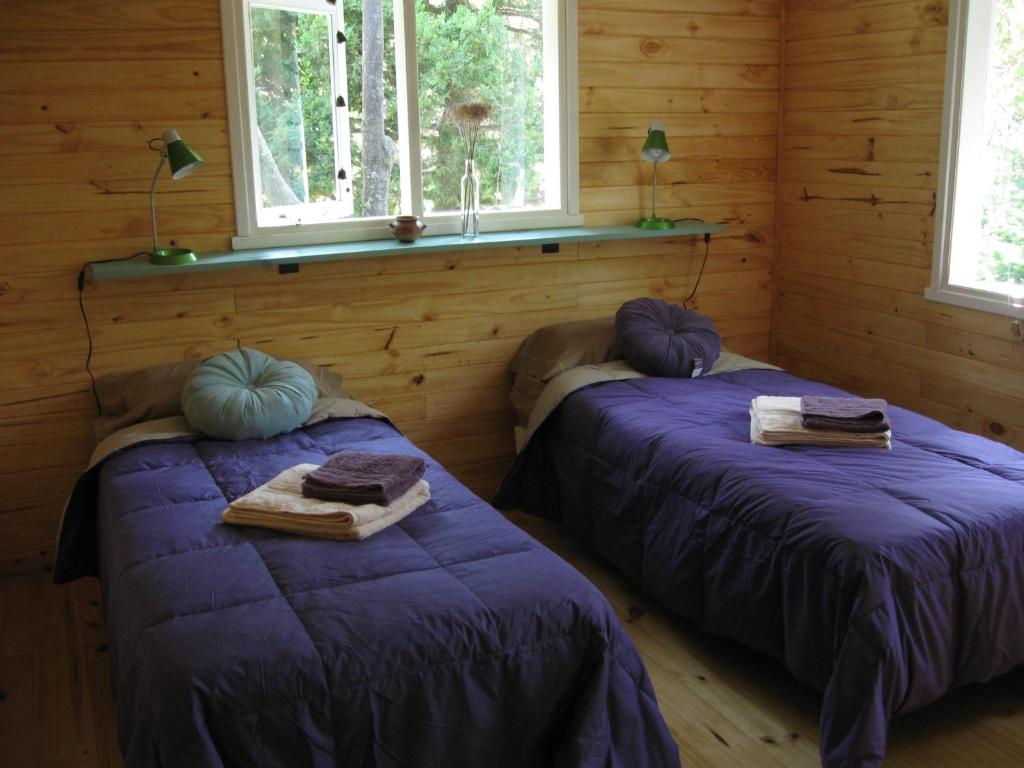 Postel nebo postele na pokoji v ubytování Dodo House
