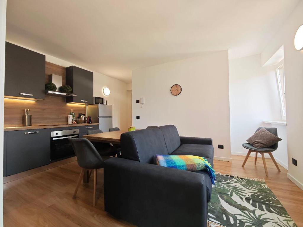 a living room with a couch and a table at Trilo Orologio in Clusone