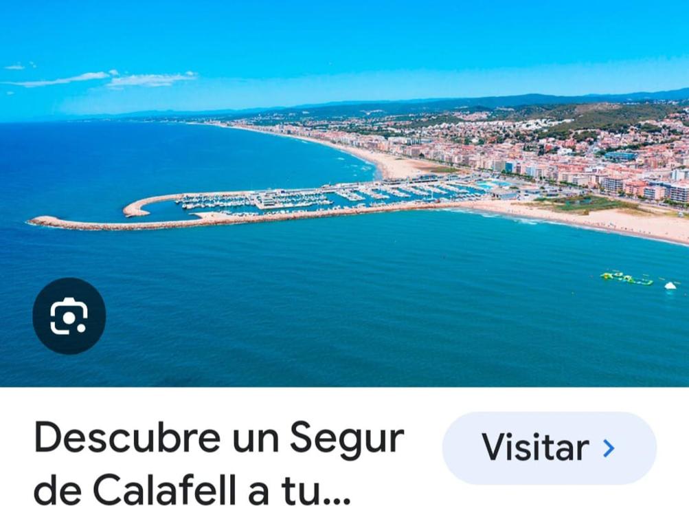 a screenshot of a text message about a beach at apartamento cerca playa ,estación tren y garaje gratis in Segur de Calafell