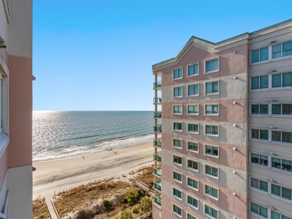 a view of the beach from the balcony of a building at Oceanfront Get Away in Myrtle Beach