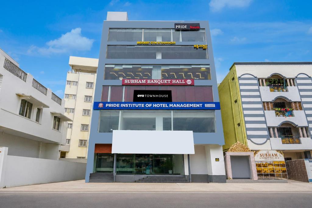 a building with a white sign in front of it at Hotel O R Eleven in Hyderabad