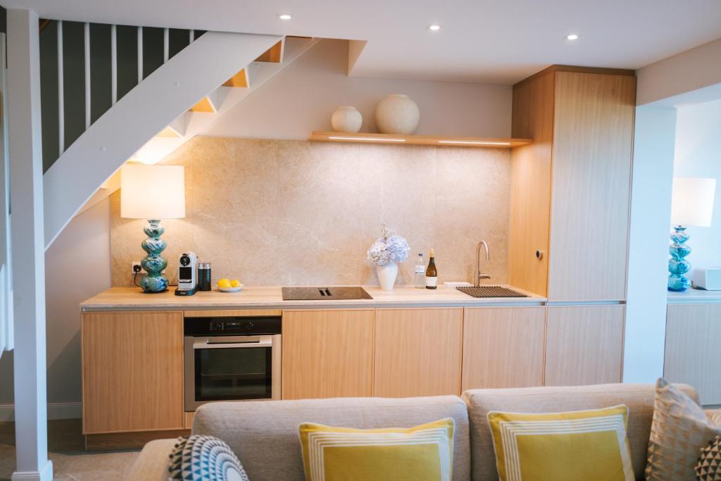 a kitchen with a sink and a counter at Sünn un See - Weststrand-Blick mit Sauna in Ahrenshoop