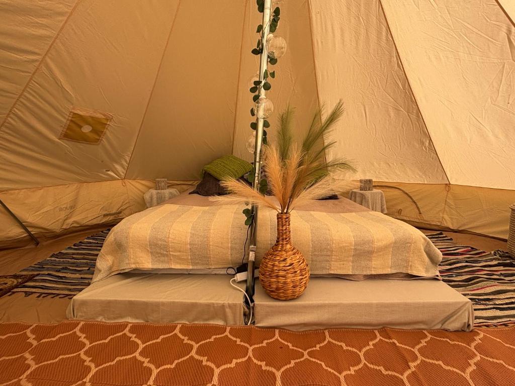a room with two beds in a tent at Lahemaa Nature Glamping - Kuma in Vihasoo