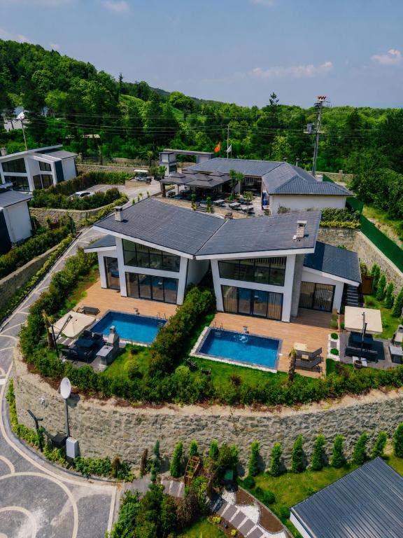 an aerial view of a house with a swimming pool at Nish Vadi Villas in Sapanca