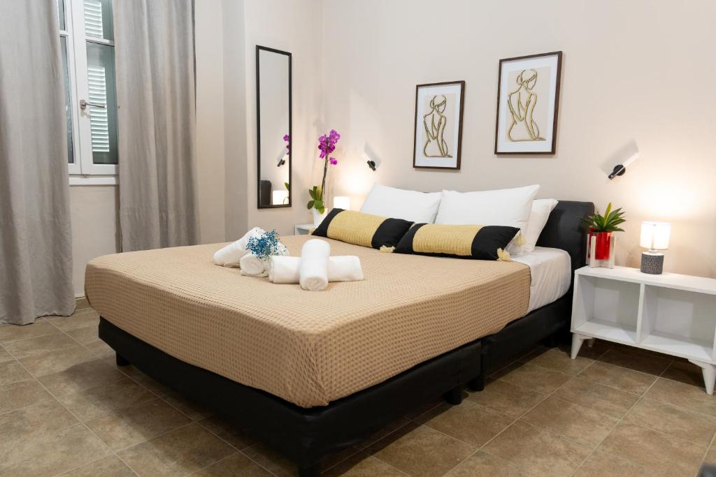 a bedroom with a bed with two stuffed animals on it at Mani Spot Casa Elia in Areopoli