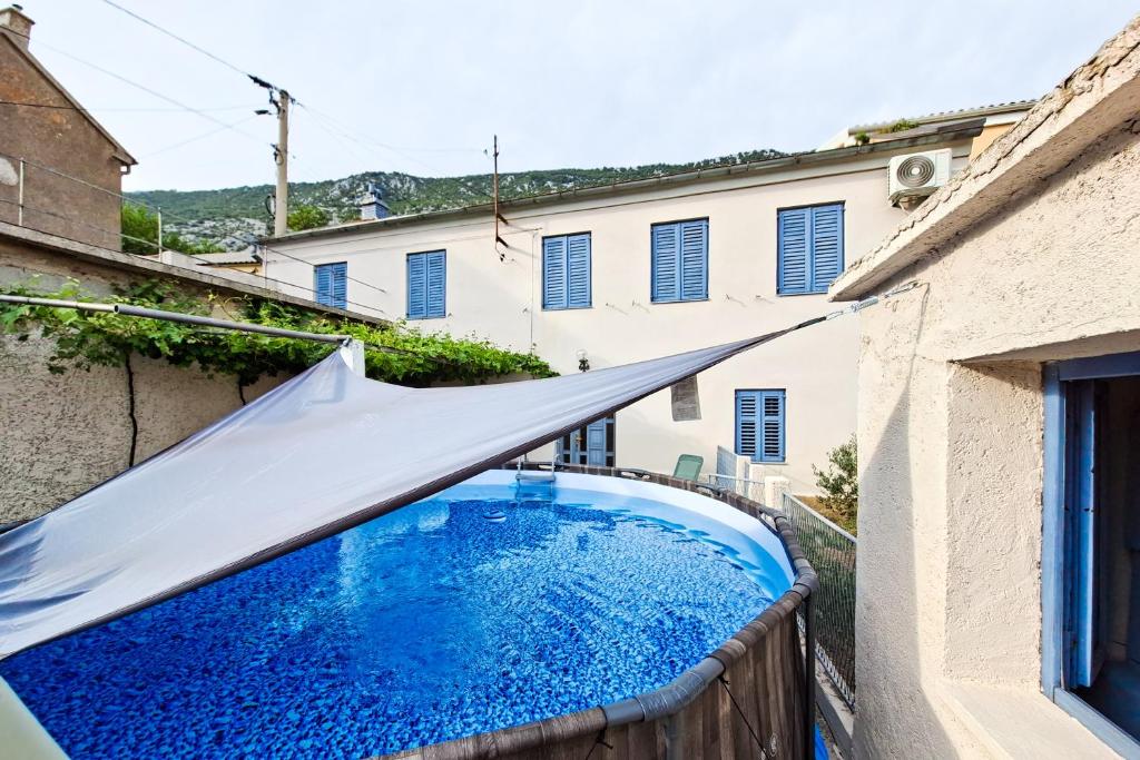 a view of a swimming pool in a house at Mediterranean House with private garden near Crikvenica in Drivenik