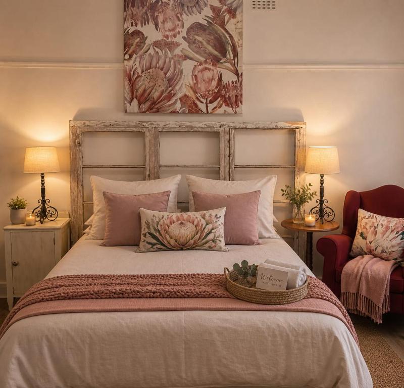 a bedroom with a large bed with a basket on it at Oranje Air B&B in Alexander Bay