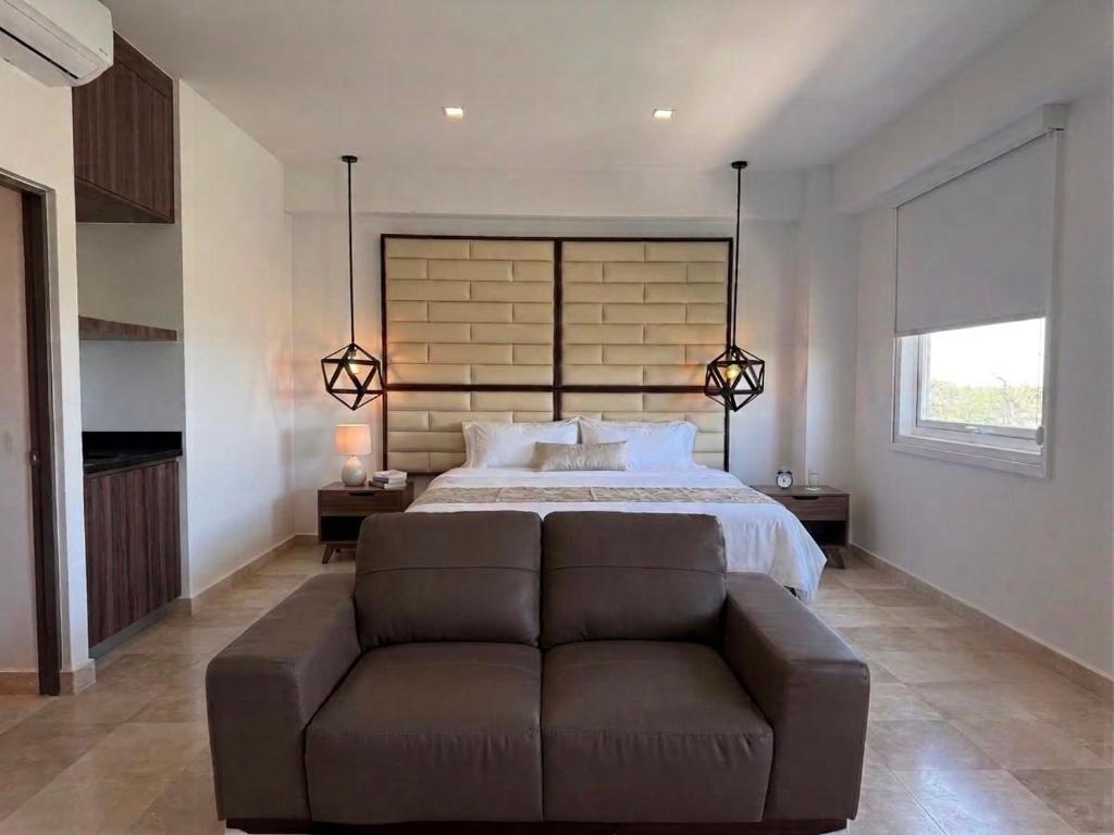 a large bedroom with a bed and a couch at San Germán in Guasave