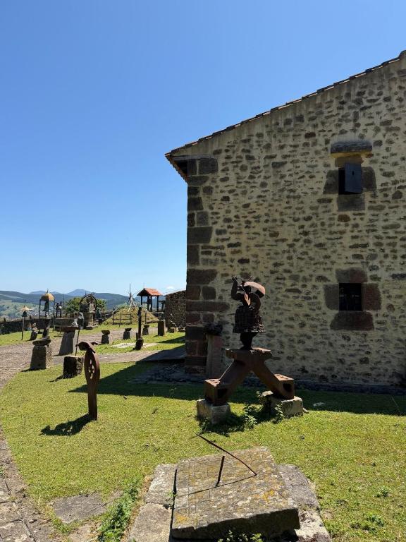a person taking a picture of a building with a camera at Museo de las Campanas, Vierna in San Bartolomé de Meruelo