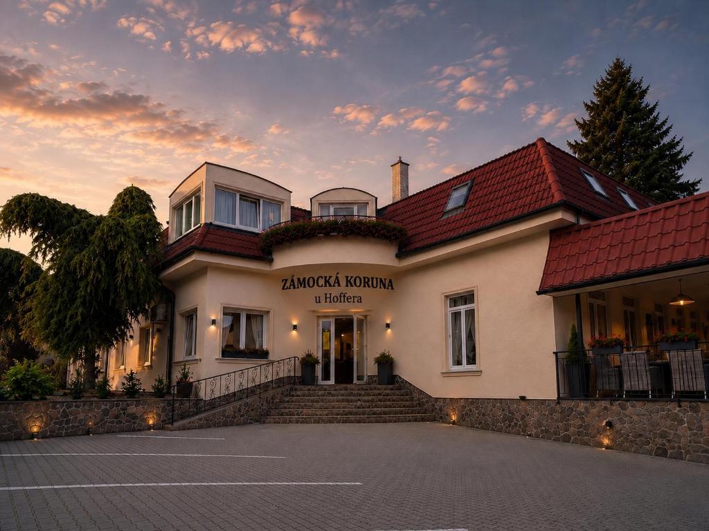 a building with a staircase in front of a building at Hotel ZÁMOCKÁ KORUNA u Hoffera in Nitra