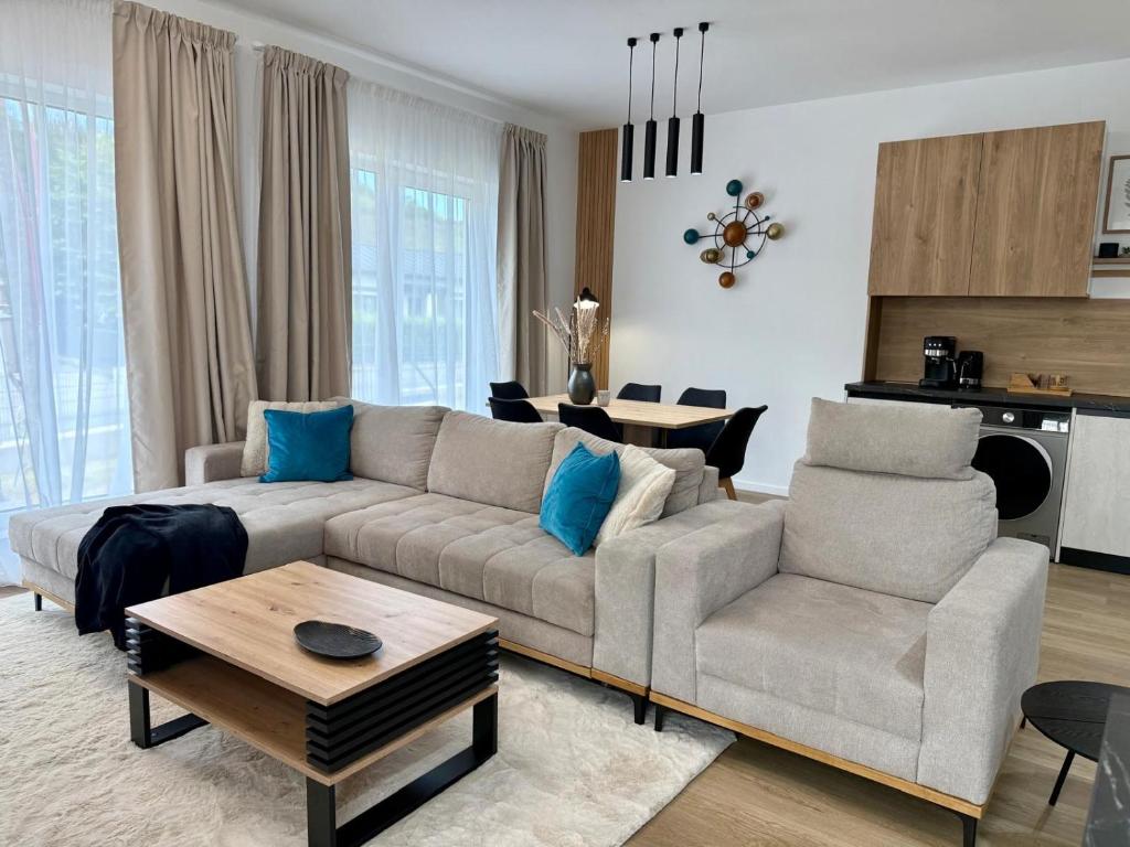 a living room with a couch and a table at Sky Residence House 5 in Cluj-Napoca