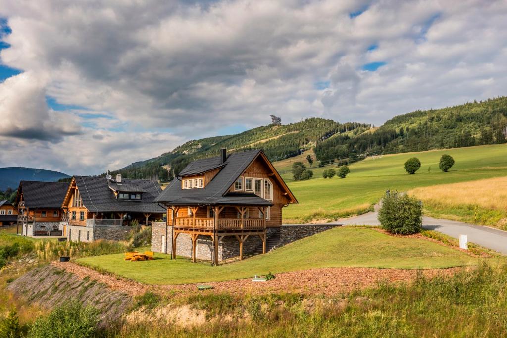 a house on a hill with a road at Roubenka Pod Oblohou in Dolní Morava