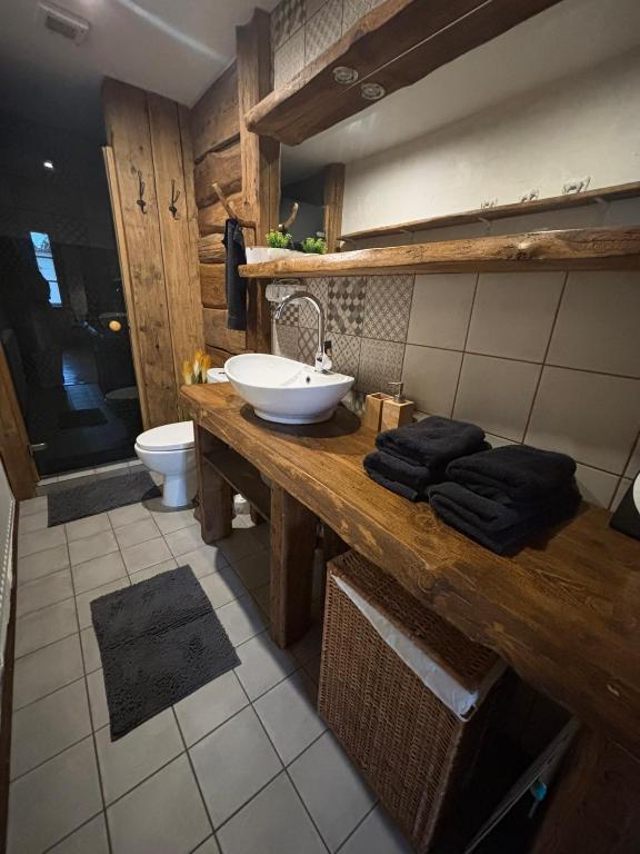 a bathroom with a sink and a toilet at Central & Quiet Cēsis Stay in Cēsis