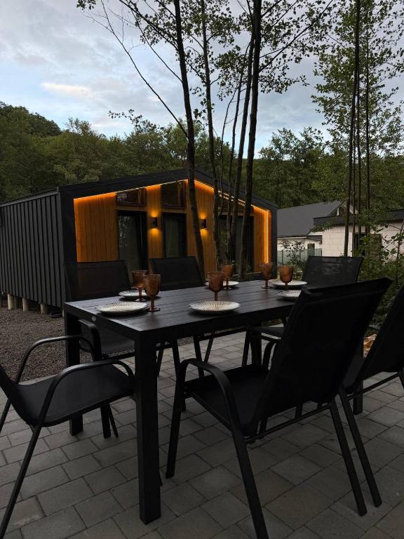 a black table and chairs on a patio at My Dream in Antalovtsi