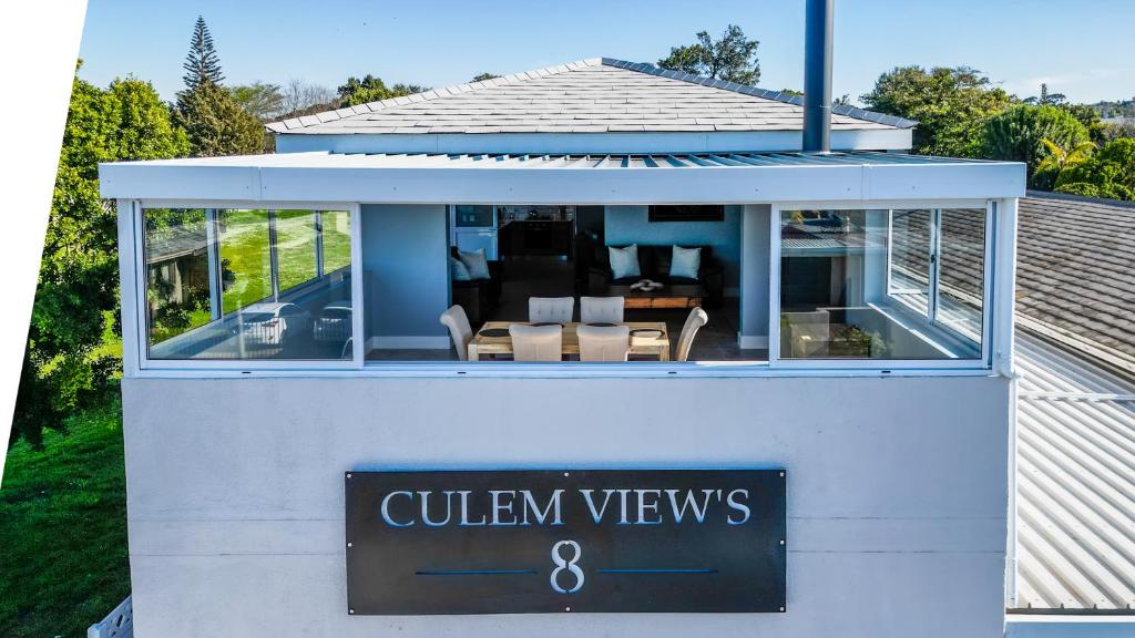 a house with a sign that says gulliven views at Culem View's in Eversdal