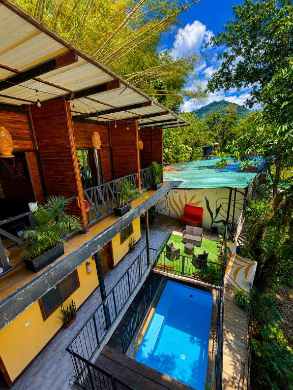an overhead view of a house with a swimming pool at Coffee House Minca in Minca