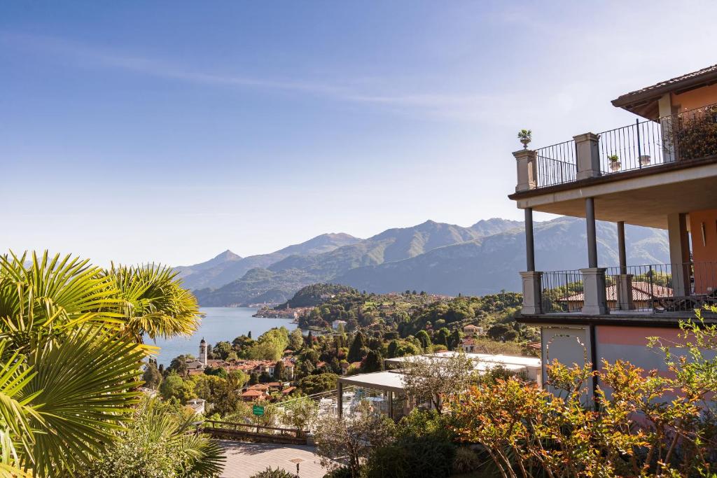 a building with a view of a lake and mountains at Borgo Le Terrazze in Bellagio