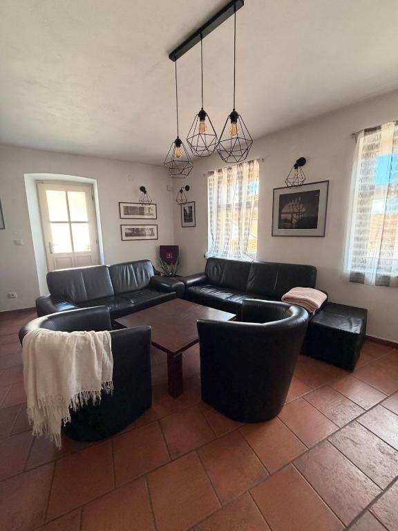 a living room with a couch and a table at RAST apartment house in Třebíč