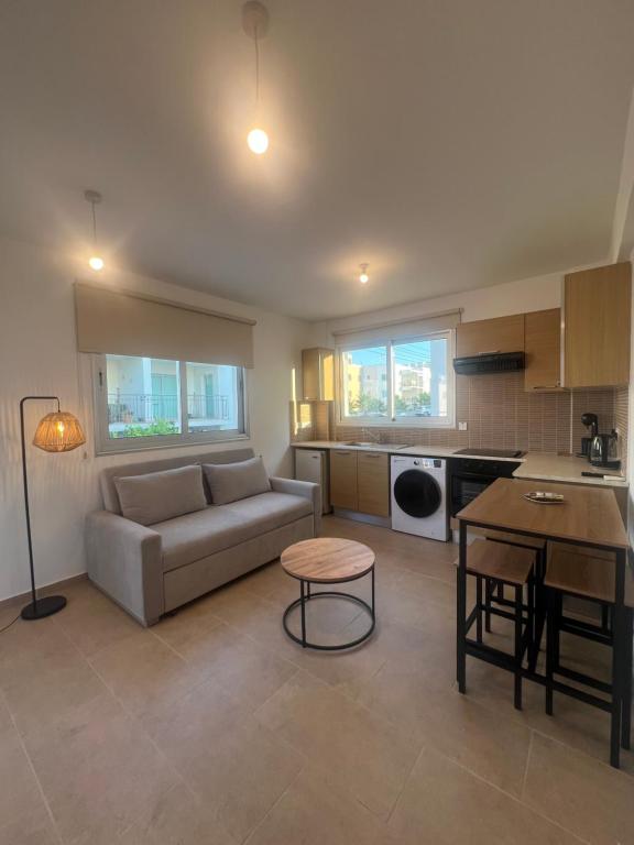 a living room with a couch and a table at Melissa 2 Block A in Paralimni