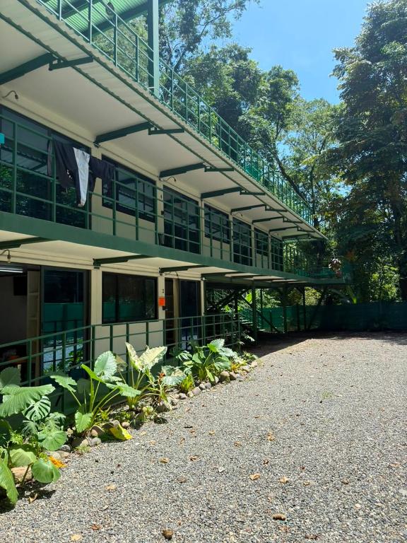 a building with a balcony and plants in front of it at Cocles Green Studios in Cocles