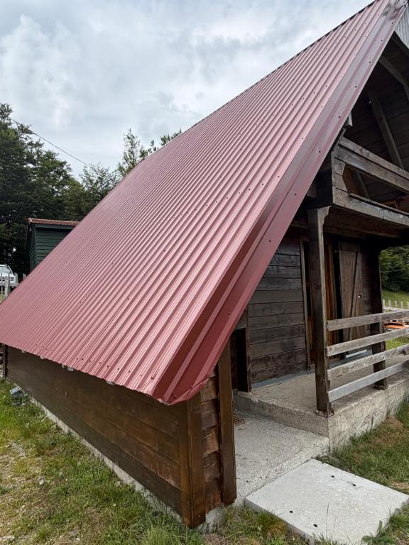 a building with a red roof on top of it at Planinska Koliba Mo in Katun Božički