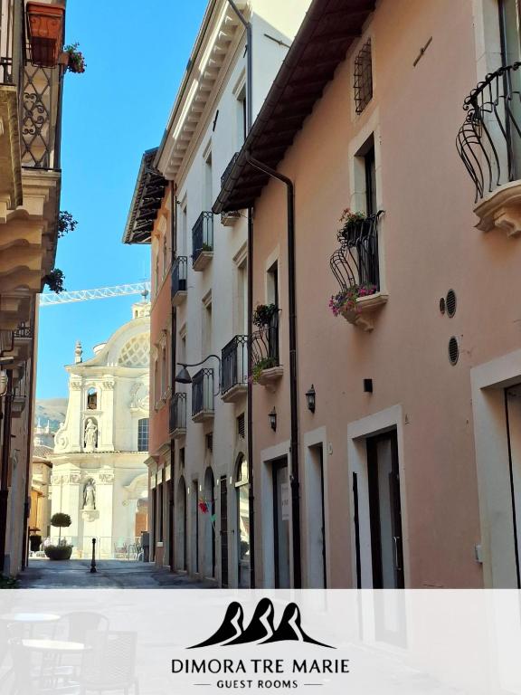 a view of a street in a city with buildings at Dimora Tre Marie in LʼAquila