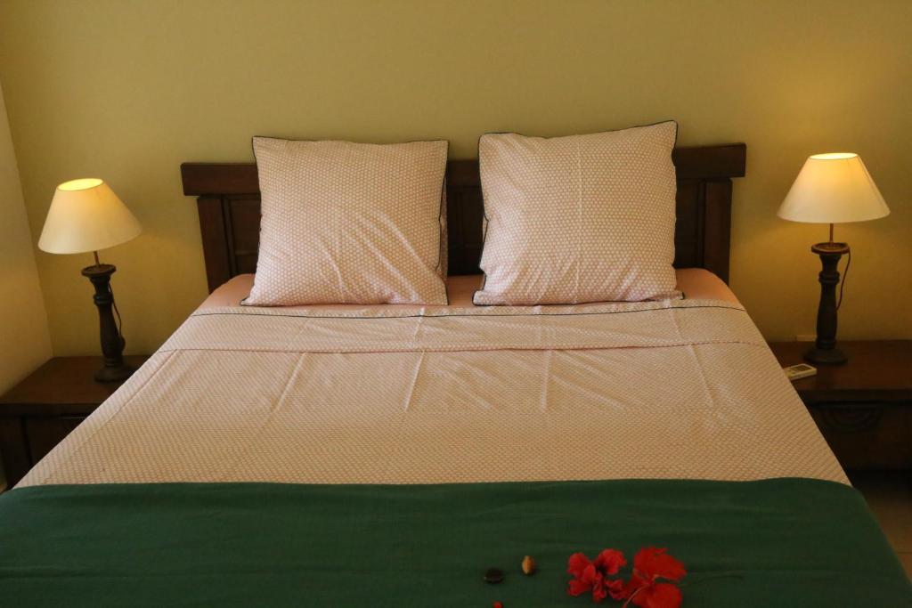 Postel nebo postele na pokoji v ubytování L'Eden des Colibris