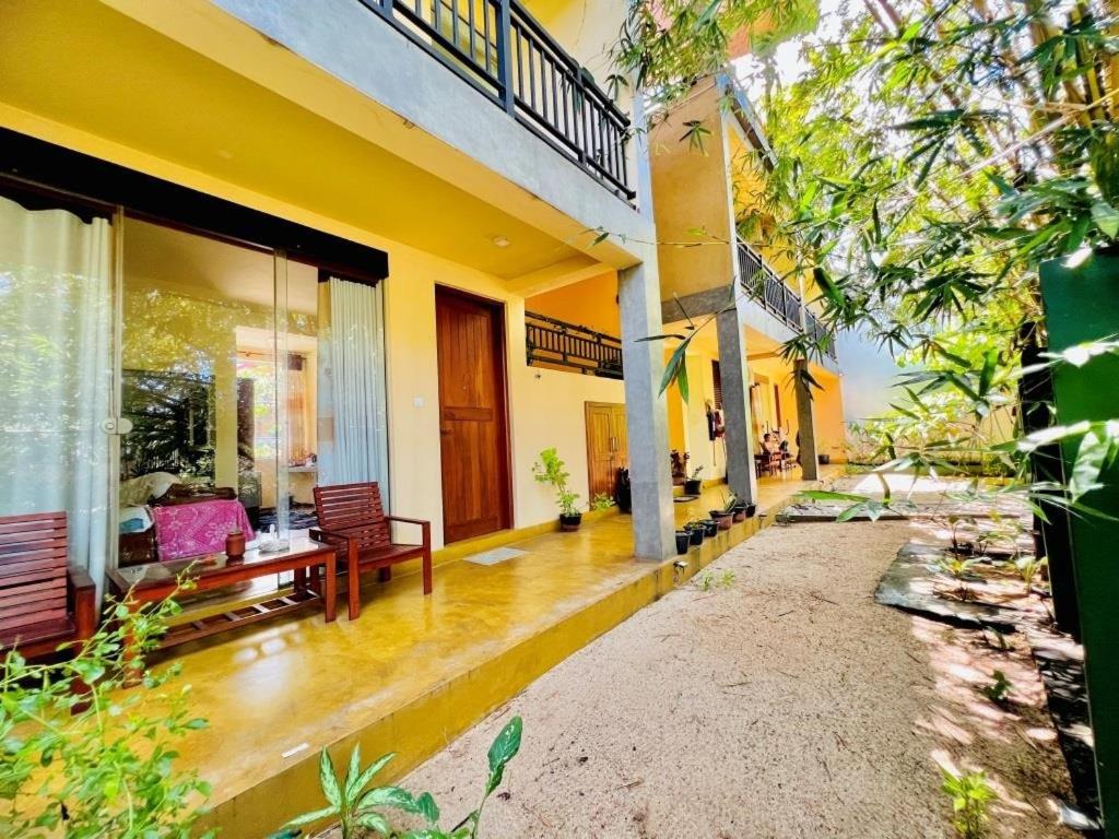 a living room of a house with a porch at Villa Rustic in Negombo