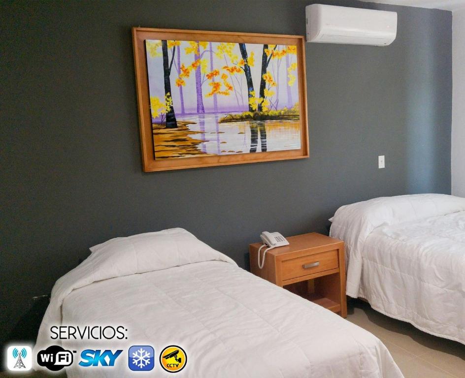 Postel nebo postele na pokoji v ubytování Casa RyS Hotel