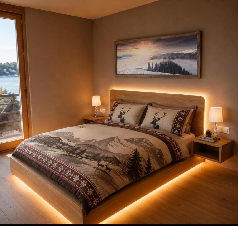a bedroom with a large bed with lights on it at Enfin Clavon - appartamento in baita in Verrayes