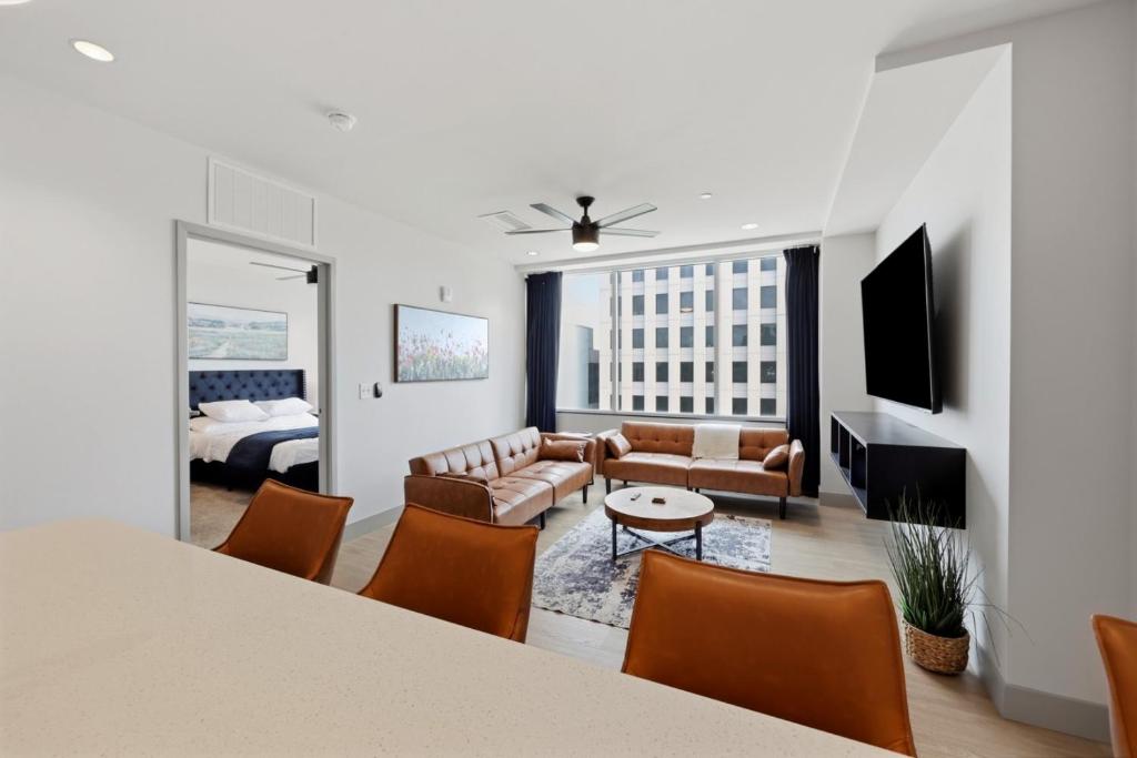 a living room with a couch and a table at 175 LEX - Walkable Downtown Lexington & Rupp Arena - Full Condos in Lexington