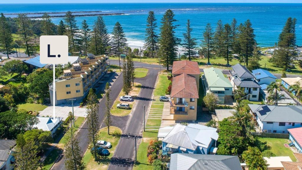 an overhead view of a residential neighbourhood with a l sign at Surf Side - Lifestyle Yamba in Yamba