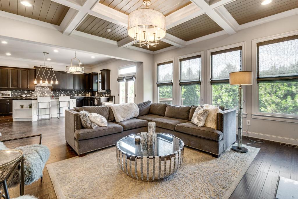 a living room with a couch and a table at Executive 5BR Stay in Duluth w/ Pool Access in Duluth