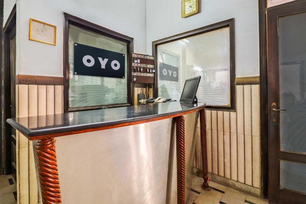 an office with a desk with a laptop on it at Hotel O Prem Chunaria in Morādābād